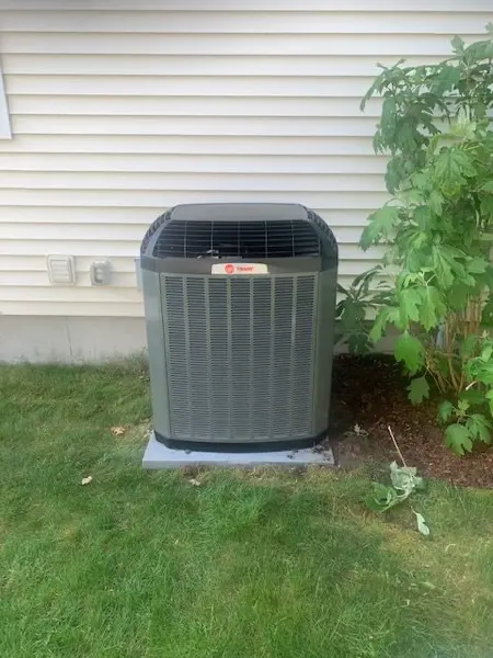 New outdoor air conditioning unit on a pad