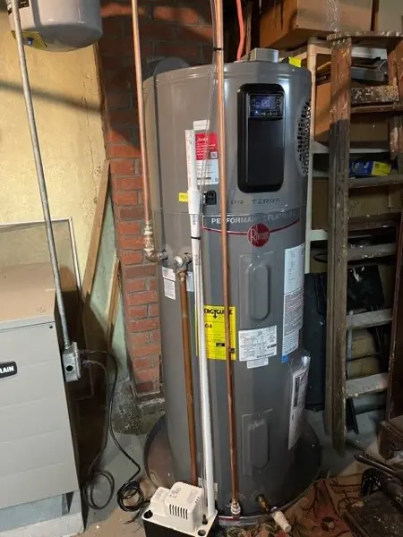 Electric water heater installed in a utility room
