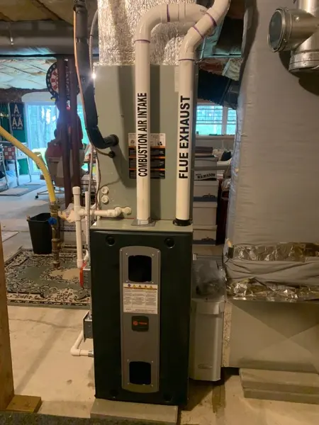 High-efficiency furnace and venting in a basement